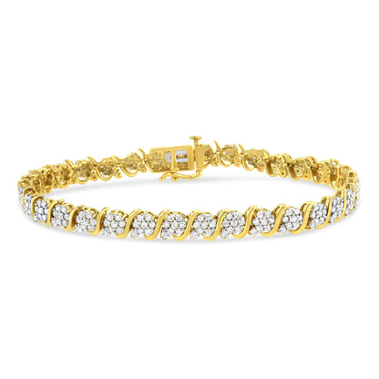 Yellow metal bracelet with alternating clusters of white round gemstones in prong settings, shown from a slight angled front view.
