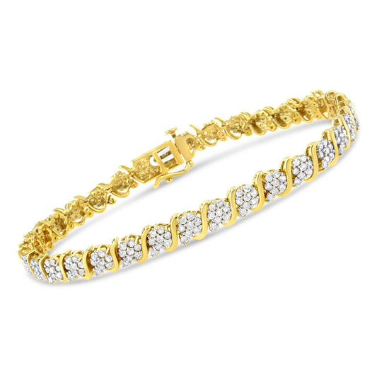 Yellow bracelet with alternating clusters of white round gemstones in prong settings, shown from an angled side view.