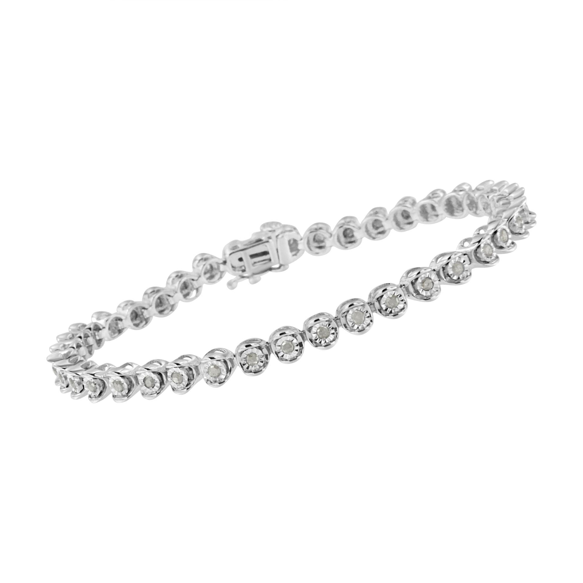 White metal bracelet with round white gemstones in a miracle setting viewed from an angled side shot.