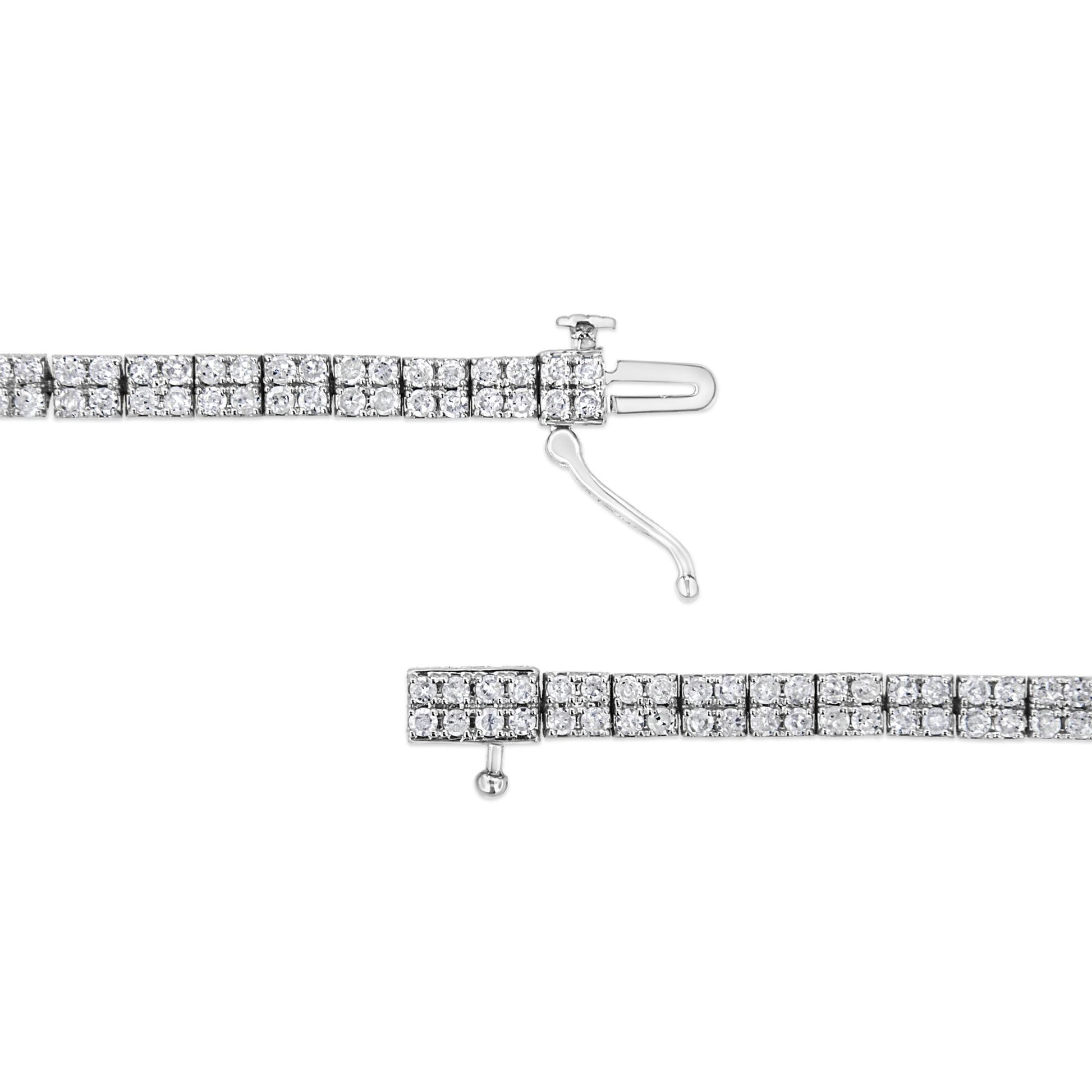 Close-up top-down view of a white bracelet with evenly spaced square sections, each set with multiple round white gemstones in a prong setting, shown unclasped on a white background.