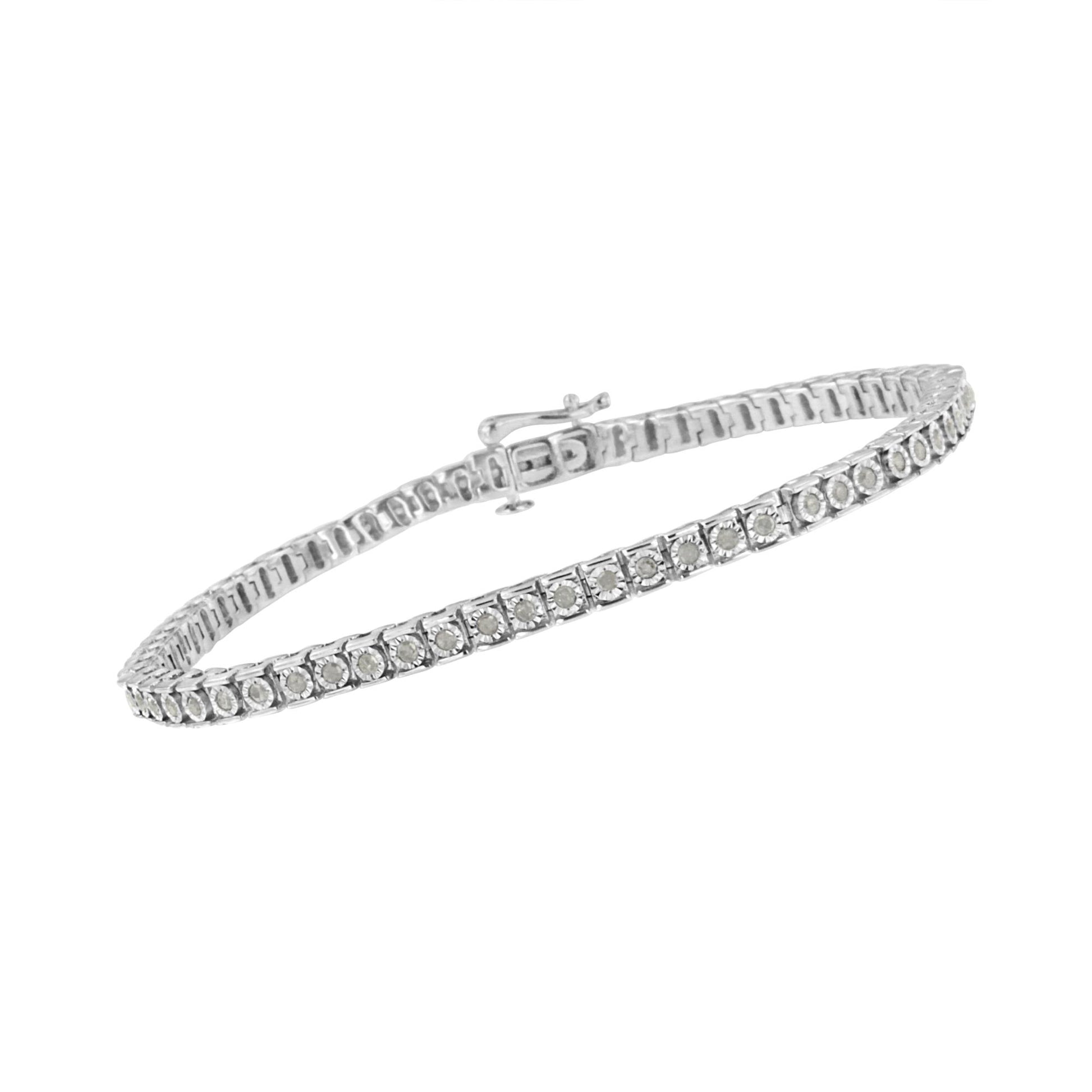 White metal bracelet with round white gemstones in channel setting, shot at a slight angle.