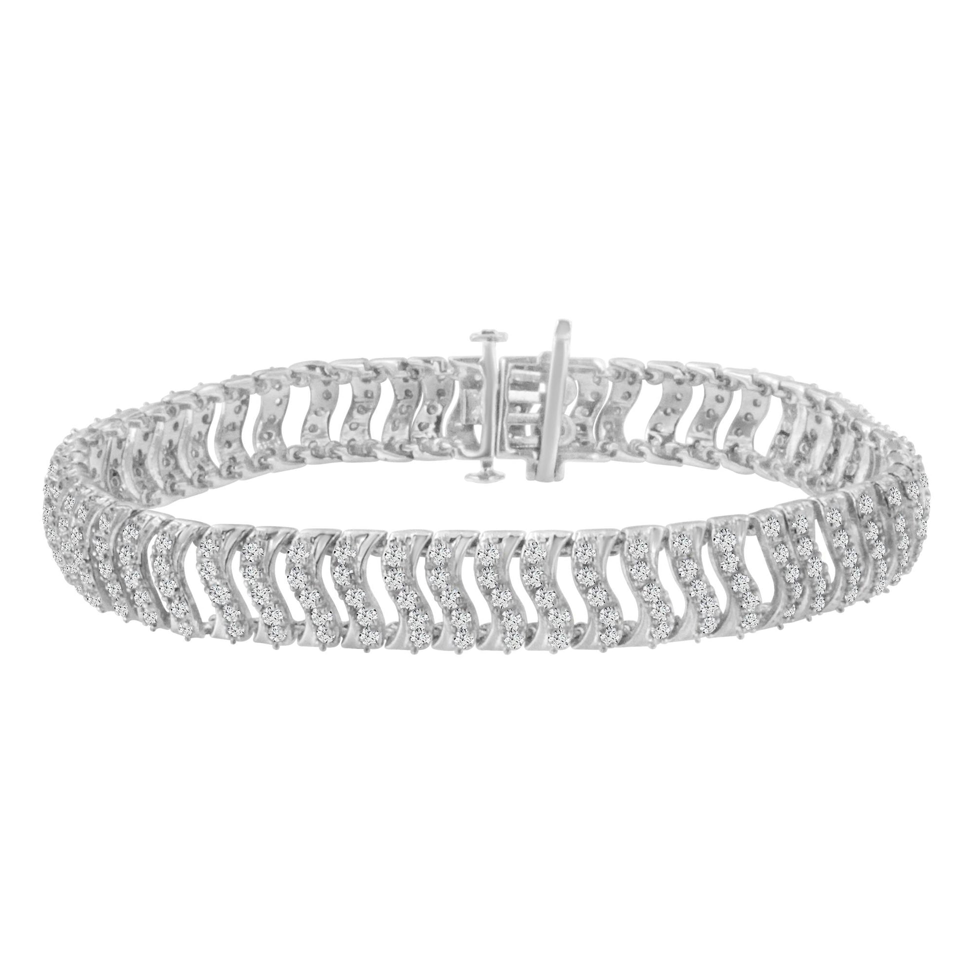White metal bracelet with round white gemstones in prong settings, shown from a front angle with clasp visible.