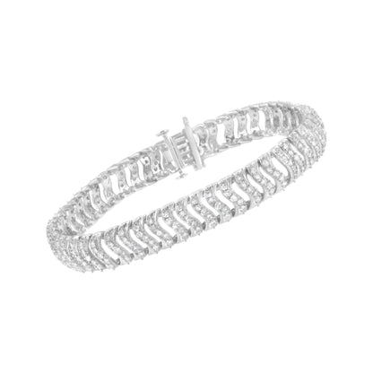 Close-up angled shot of a white metal bracelet with rows of round white gemstones in prong settings.