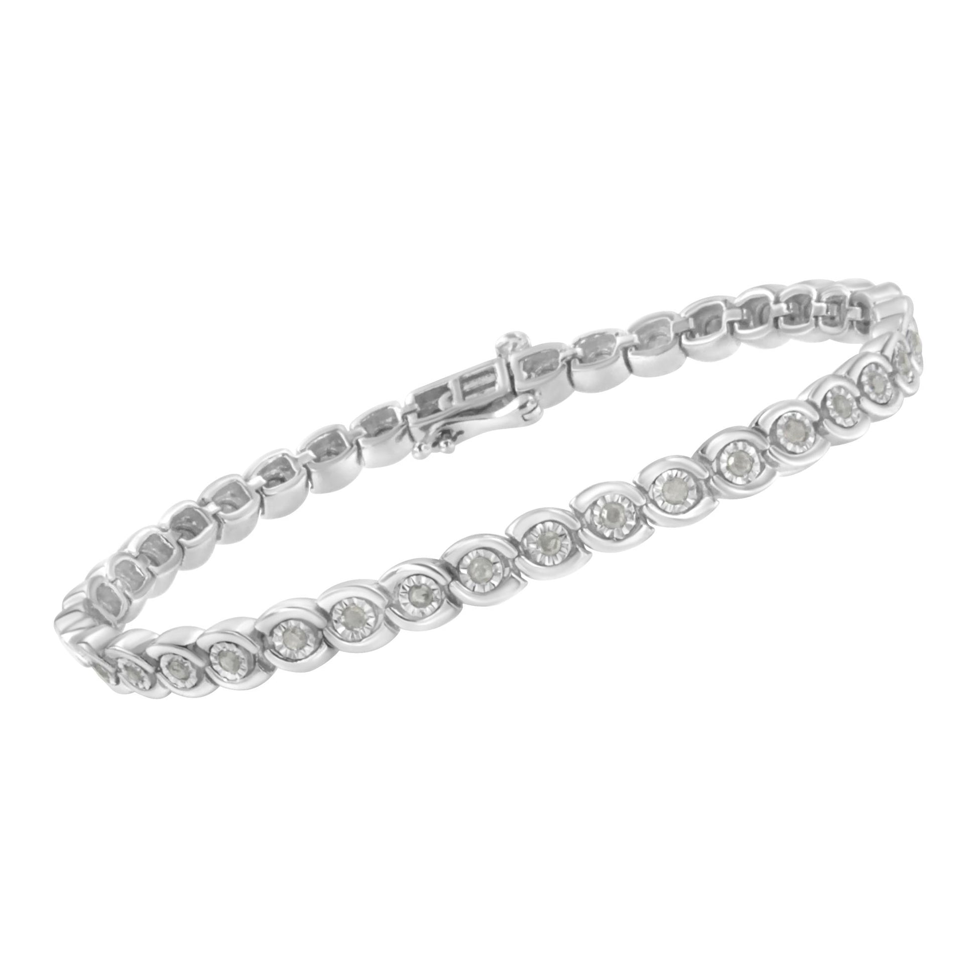 White metal bracelet with round white gemstones in miracle settings, shown in a close-up angled view.