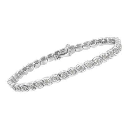White metal bracelet with round white gemstones in miracle settings, shown in a close-up angled view.