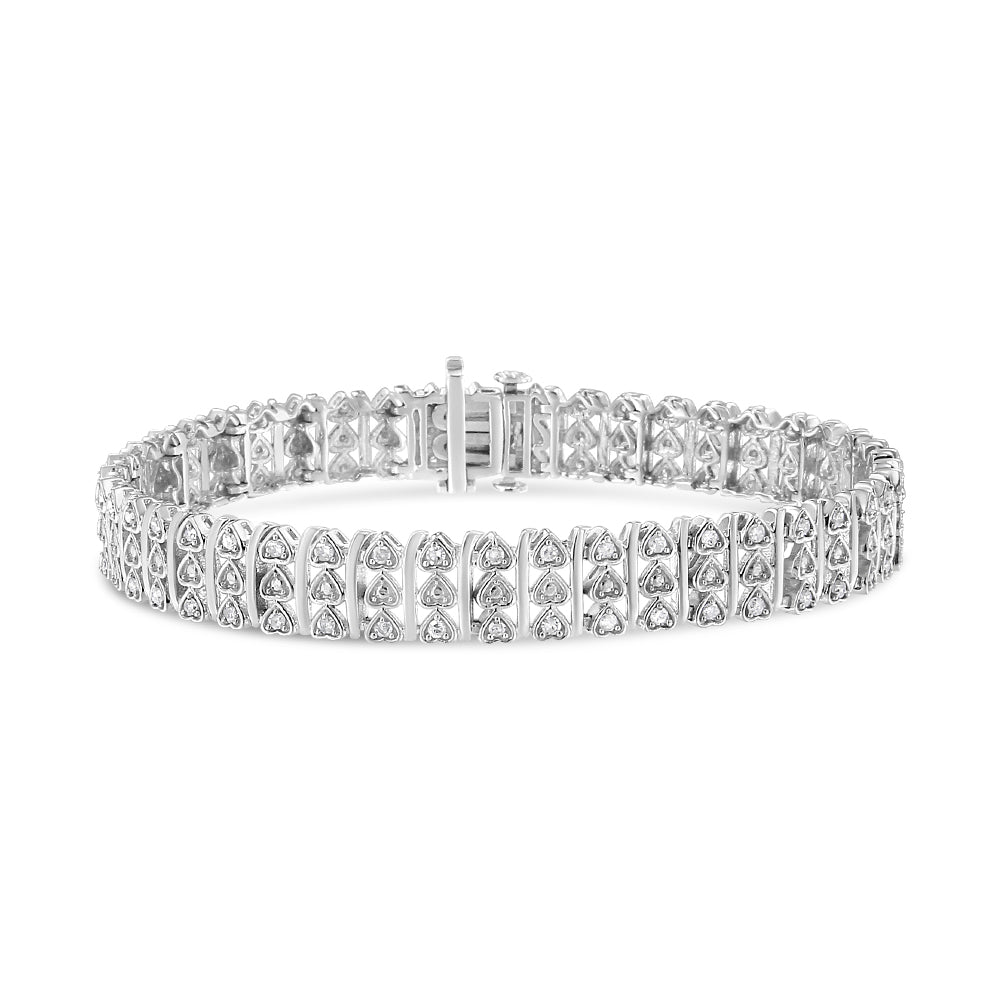Bracelet with rows of heart-shaped links each set with round white gemstones, shown from a front angle on a white background.