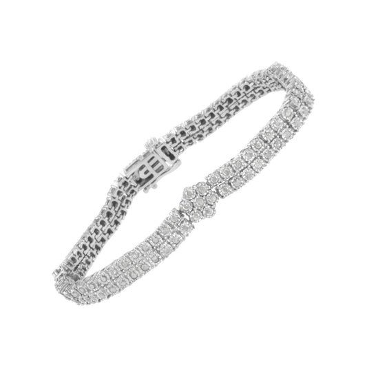 Diagonal top view of white metal bracelet with round white gemstones in miracle setting and detailed clasp.