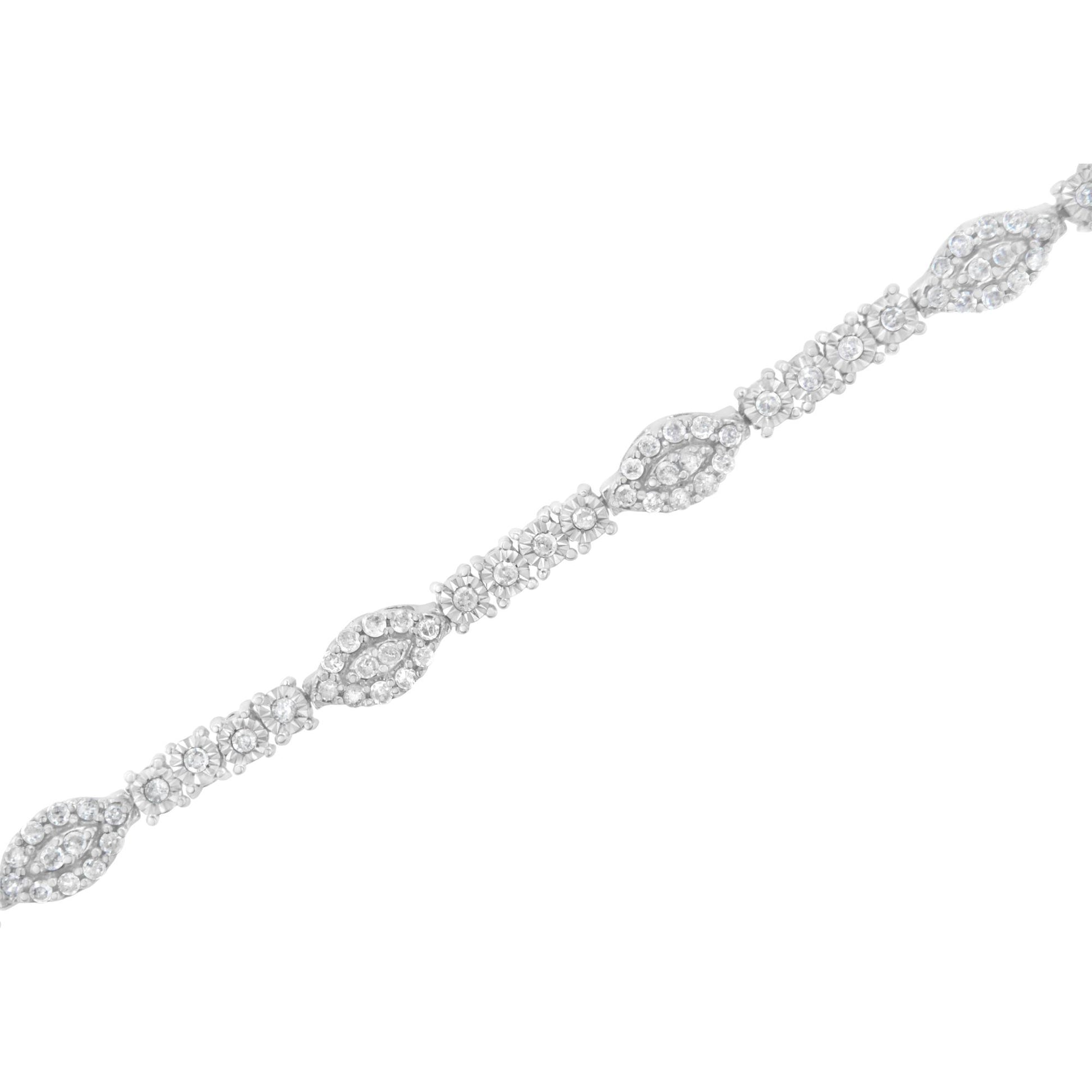 Diagonal close-up of a white metal bracelet with alternating sections of round white gemstones in prong and miracle settings.
