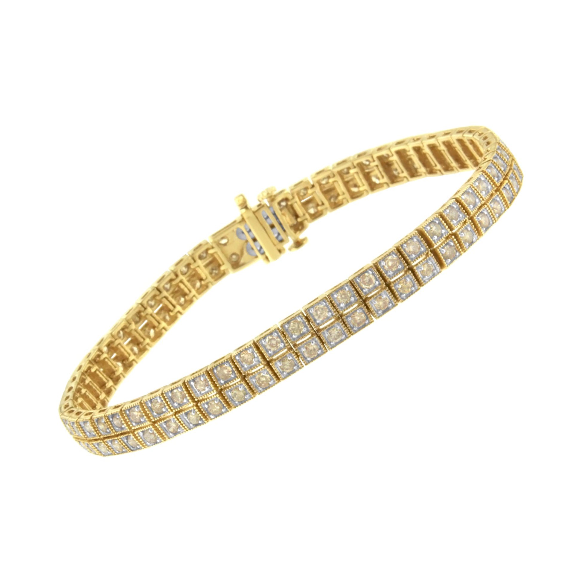 Yellow metal bracelet with prong-set round brownish gemstones in a grid pattern, shown at a slight angle.