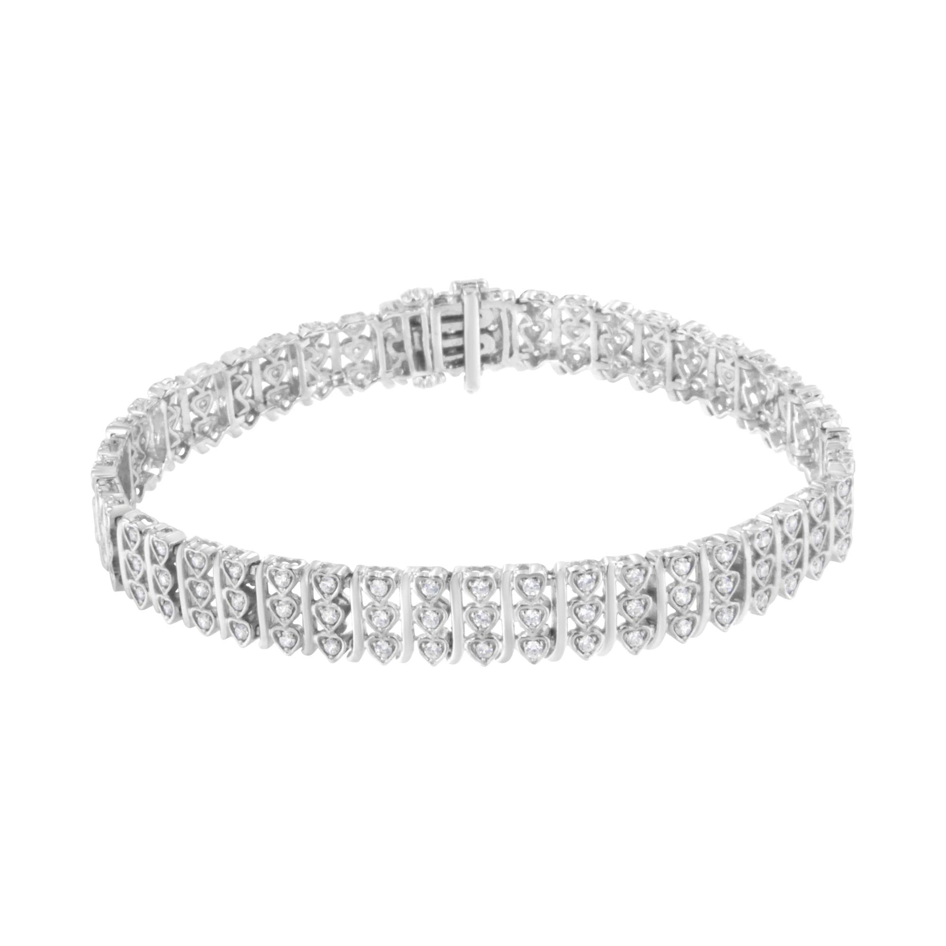 White metal bracelet with multiple round white gemstones in prong settings, shown from a top angled view.