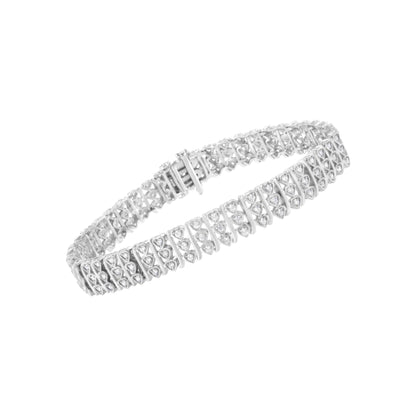 White metal bracelet with rows of round white gemstones in prong settings, shown at an angled top view.