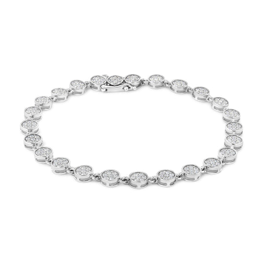 White metal bracelet with round-shaped white gemstones in prong settings, shown from a top angle.