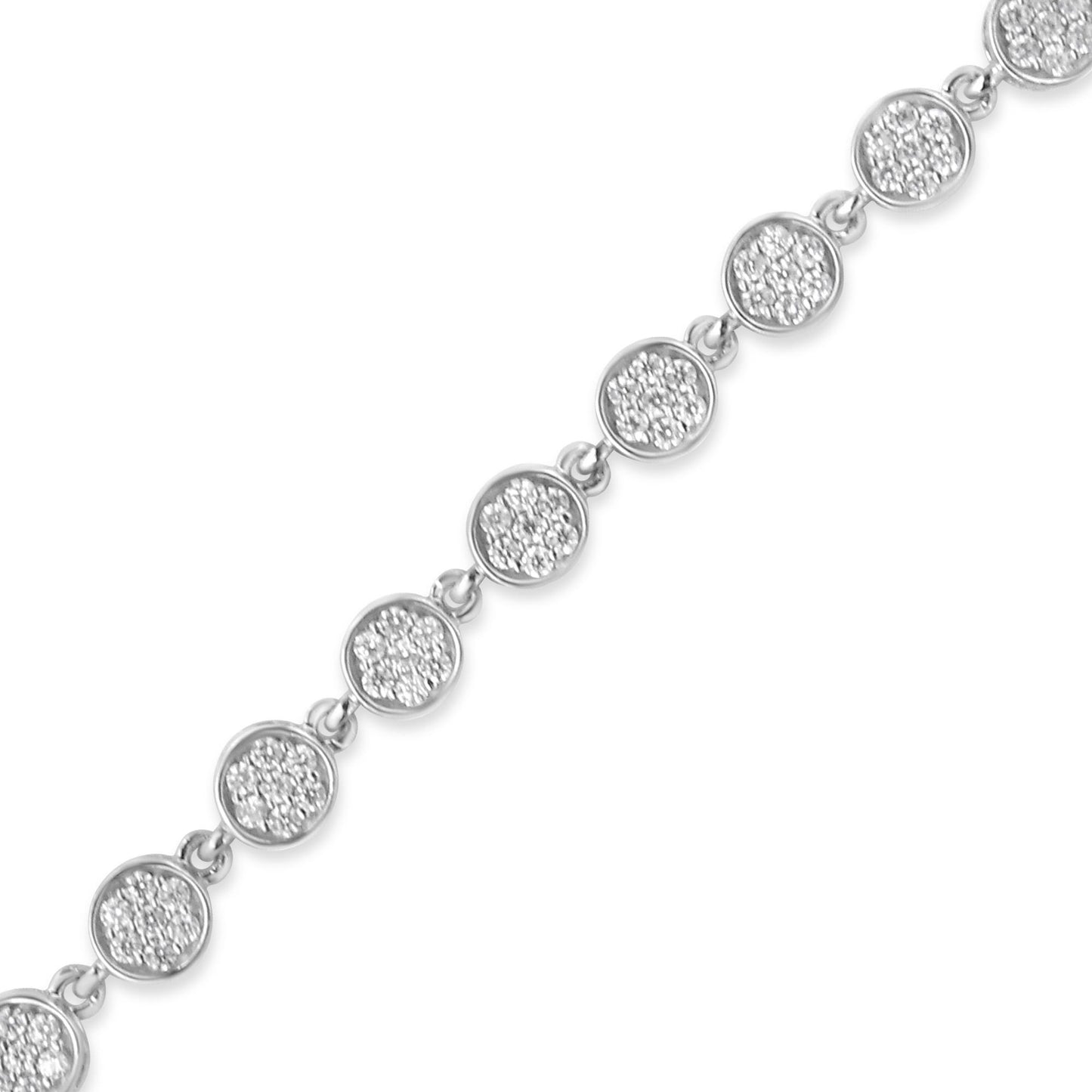 Diagonal close-up of a white metal bracelet featuring round clusters of white gemstones in prong settings.