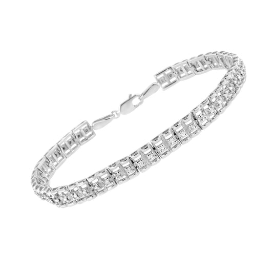 White metal bracelet with linked design and round white gemstones set in prongs, shown at an angled top view.