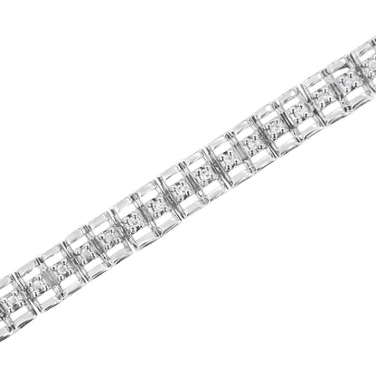 Close-up diagonal shot of a white metal bracelet featuring linked square sections each with a round white gemstone in prong setting.