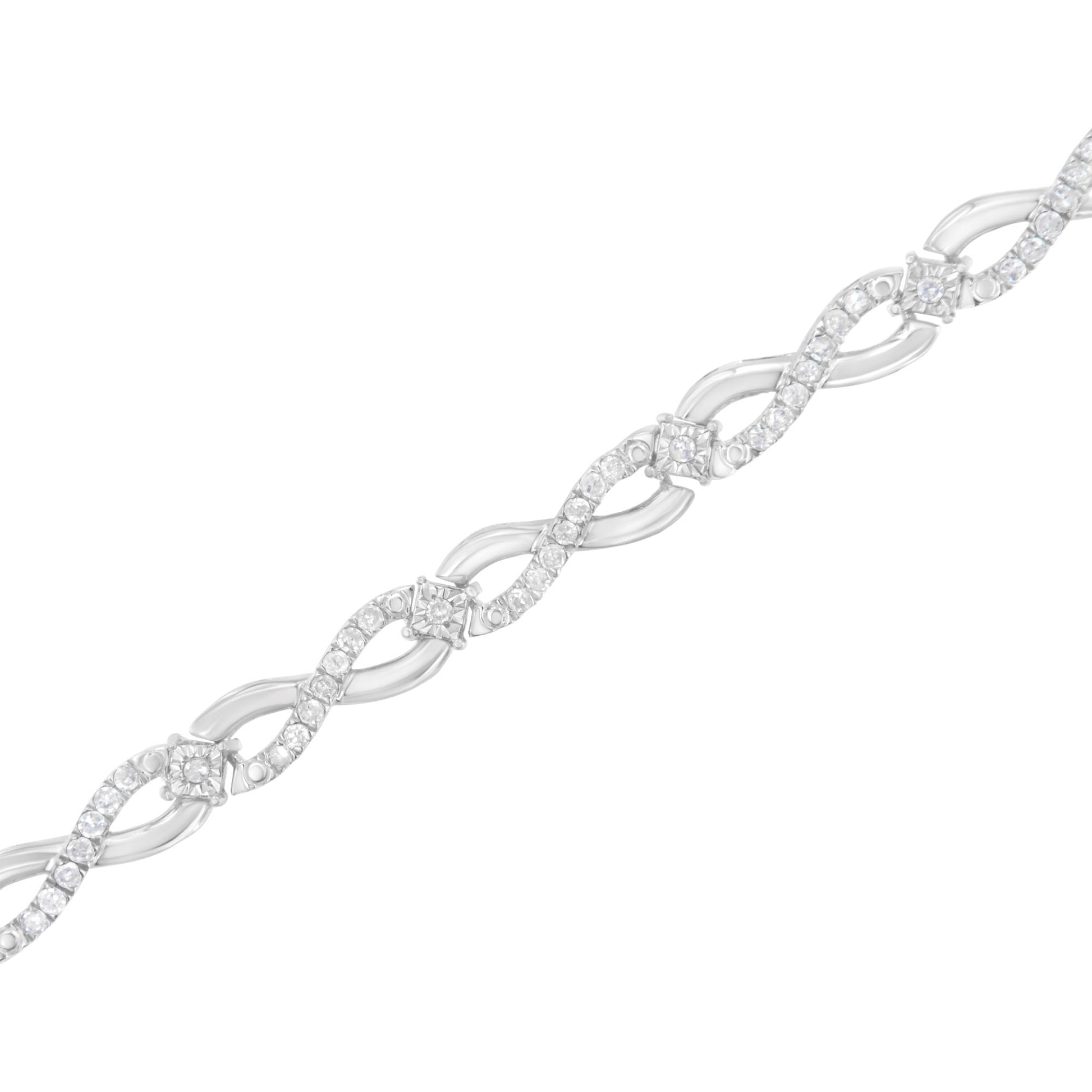 Diagonal close-up of a white metal bracelet with an alternating twisted design set with round white gemstones in prong settings.