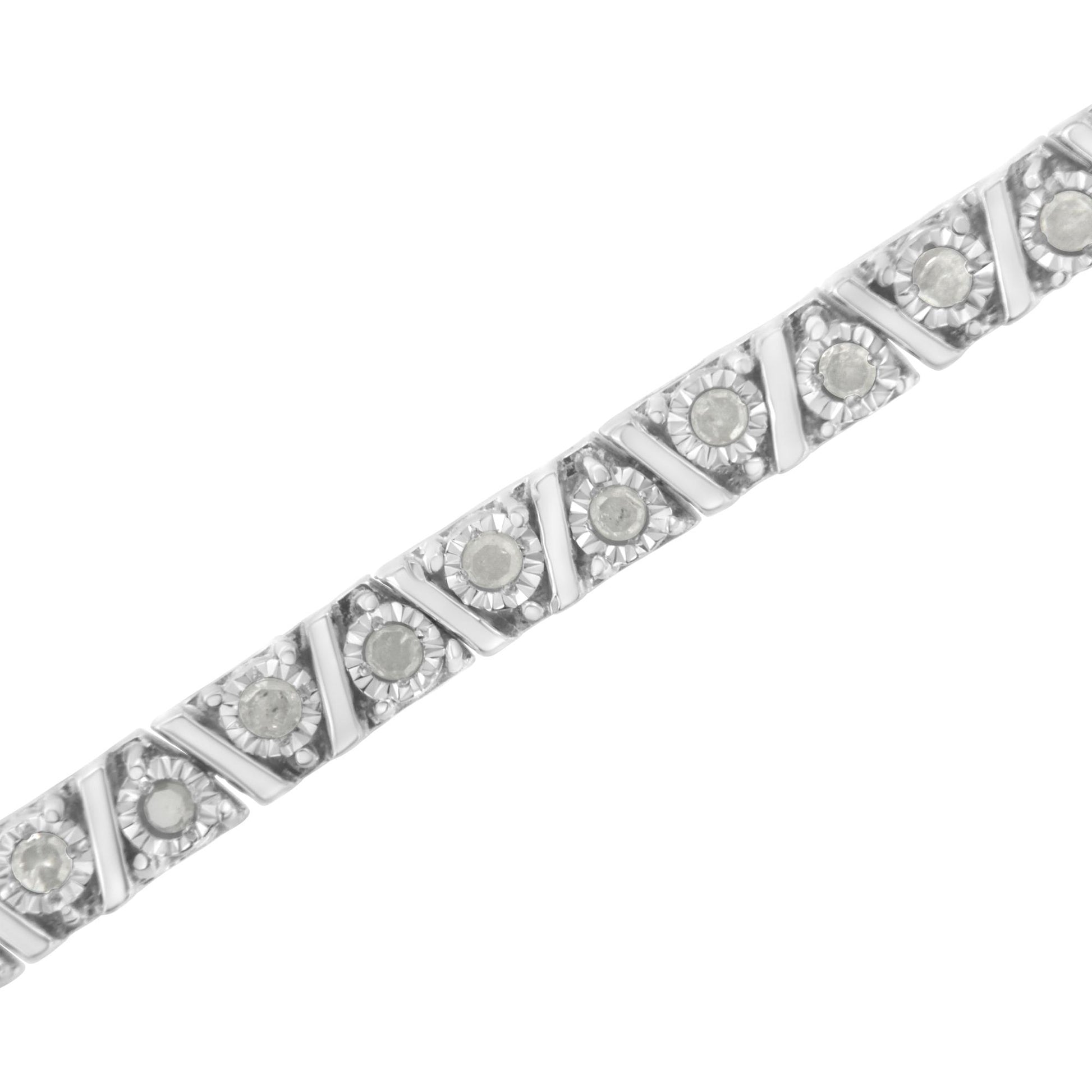 Diagonal close-up of a white metal bracelet with round white gemstones in a miracle setting.