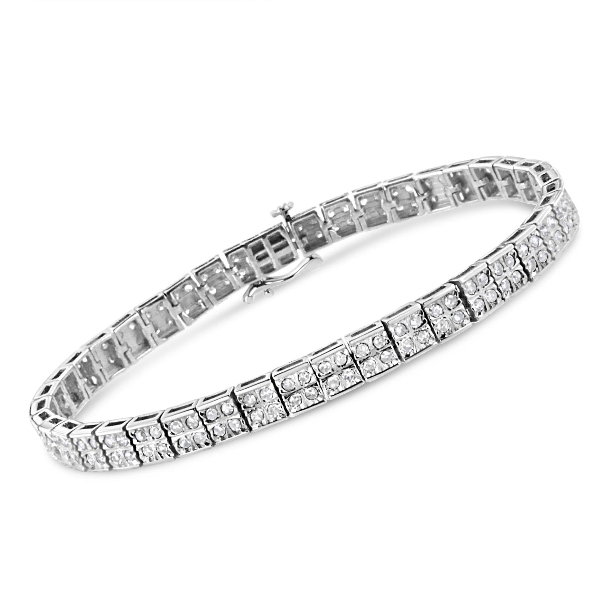 White metal bracelet with multiple square links set with round white gemstones in prong settings, shown at a slight angle.