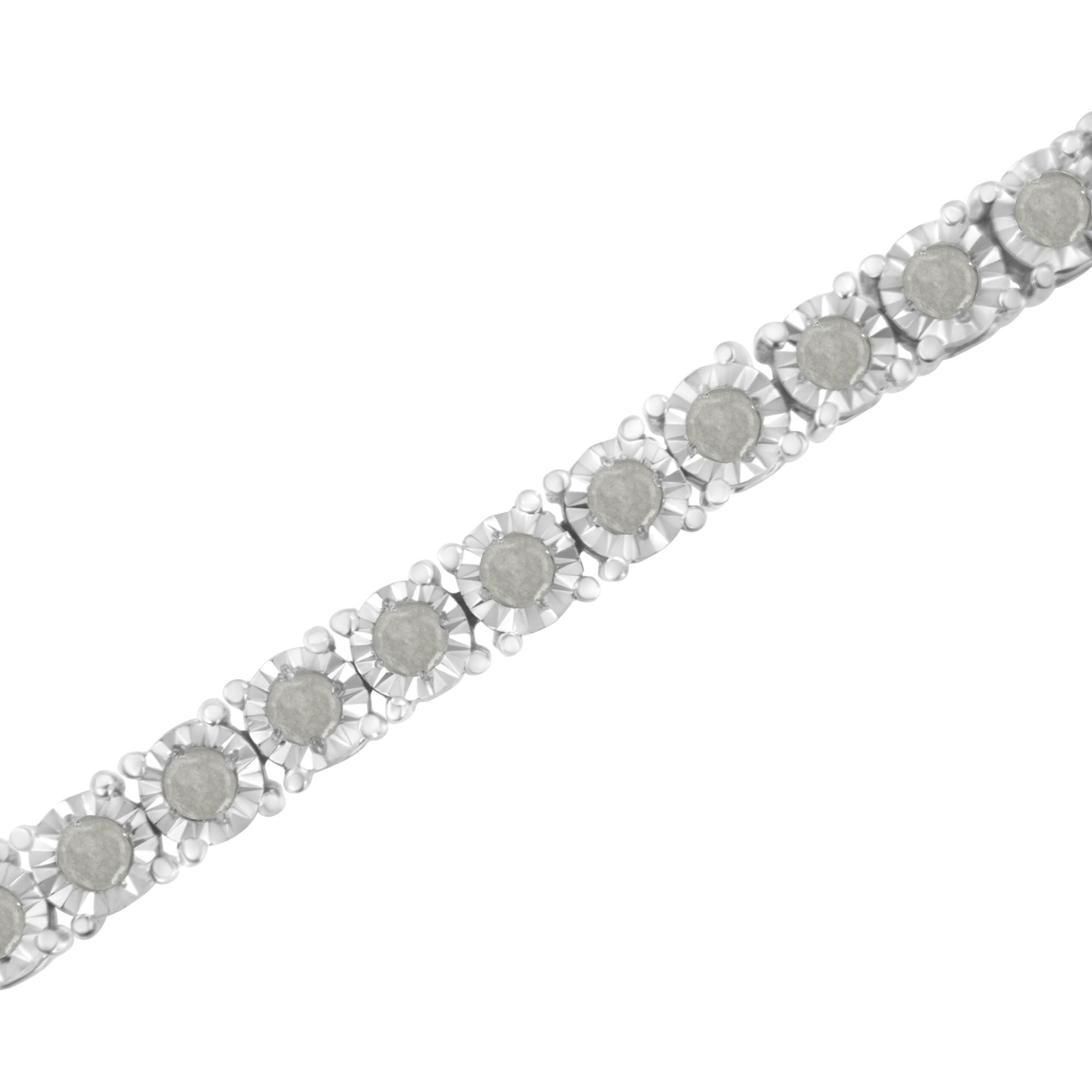 Close-up, diagonal view of a white bracelet featuring round white gemstones in a miracle setting.