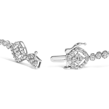 Close-up angled view of a white metal bracelet with round white gemstones in prong and miracle settings, featuring a decorative geometric clasp.