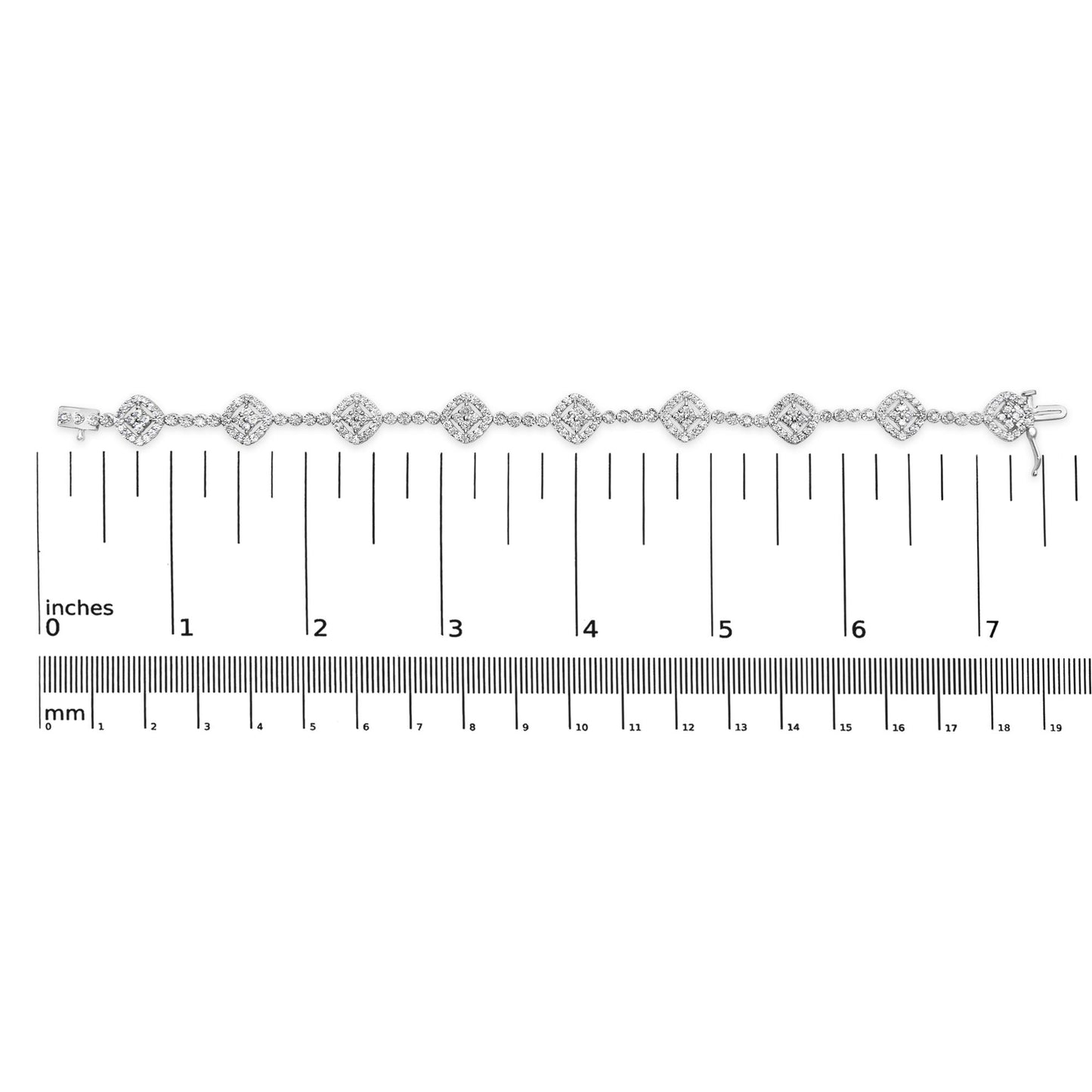 White metal bracelet with round white gemstones in miracle and prong settings, displayed flat on a ruler for size reference, top-down view.