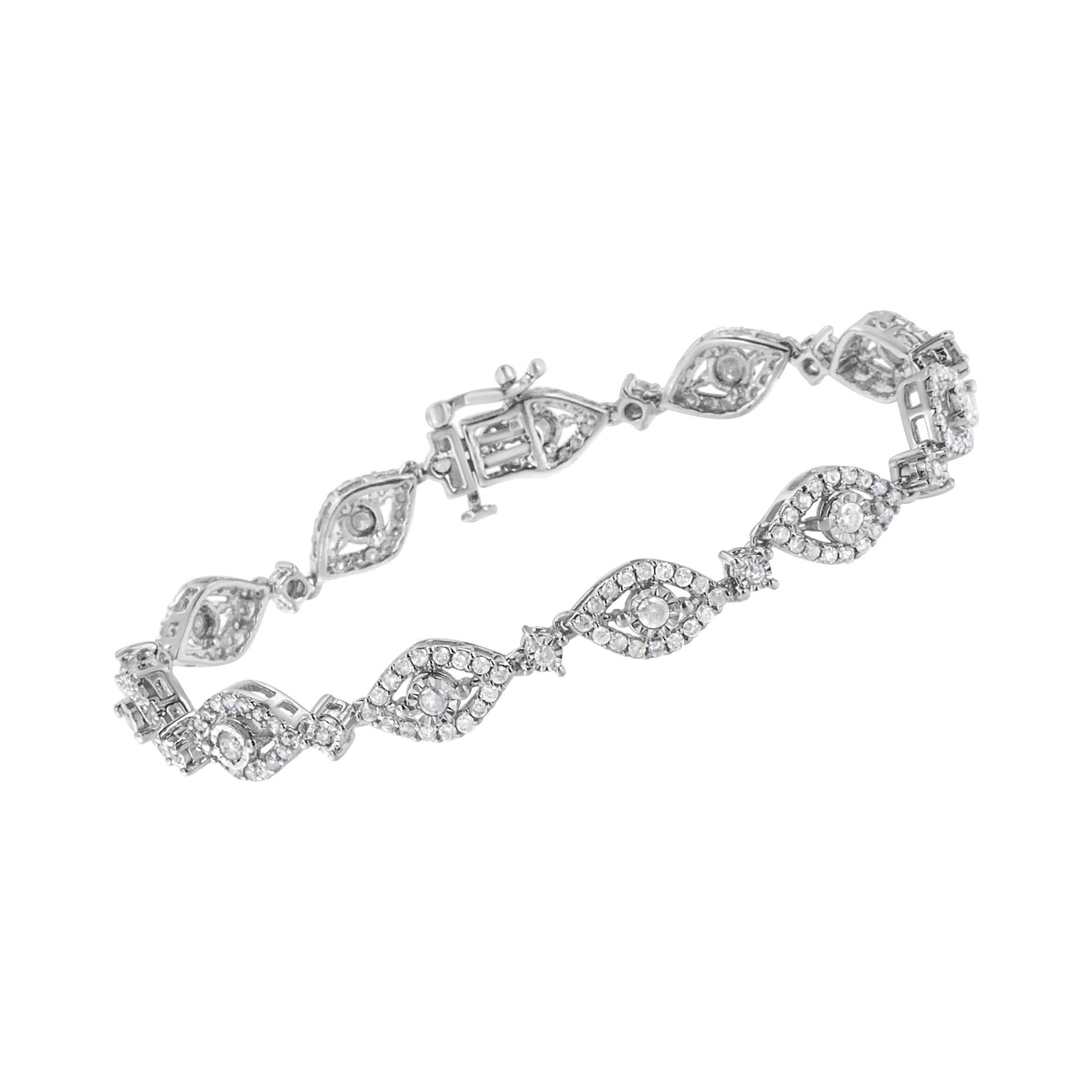 White metal bracelet with round white gemstones in miracle and prong settings, shown in a close-up angled view.