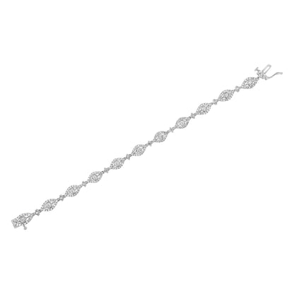 White metal bracelet shown in a flat lay angled view, featuring alternating marquise-shaped links with white gemstones in miracle settings and sections with small round white gemstones in prong settings.