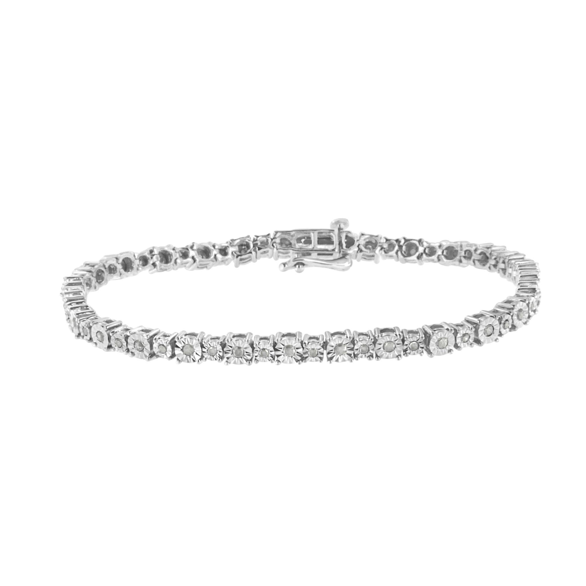 White metal bracelet with round white gemstones in miracle setting, shown from a front angle on a white background.