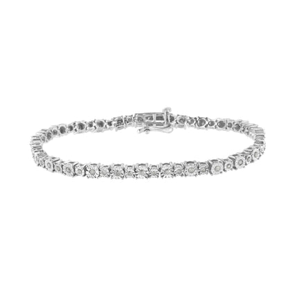 White metal bracelet with round white gemstones in miracle setting, shown from a front angle on a white background.