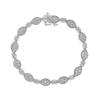 Top-down view of a white metal bracelet with alternating marquise-shaped and round settings, each containing multiple white gemstones in a miracle setting.