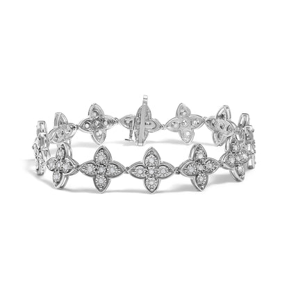 Front angle view of a white metal bracelet featuring linked quatrefoil-shaped elements set with round white gemstones in a miracle setting.