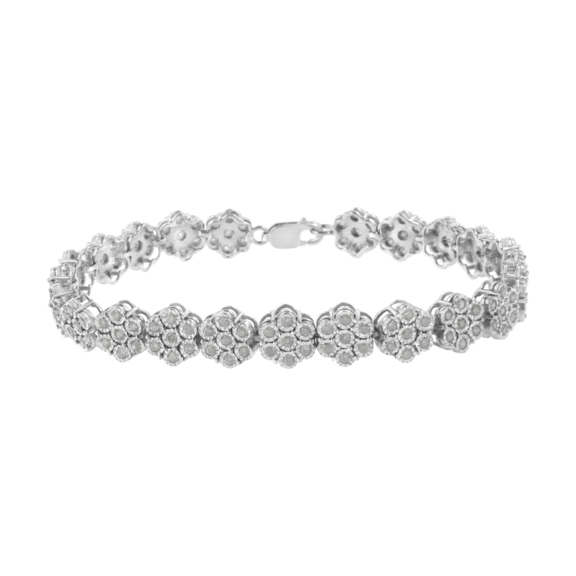 White metal bracelet with flower-shaped links each set with round white gemstones, shown from a front angle.