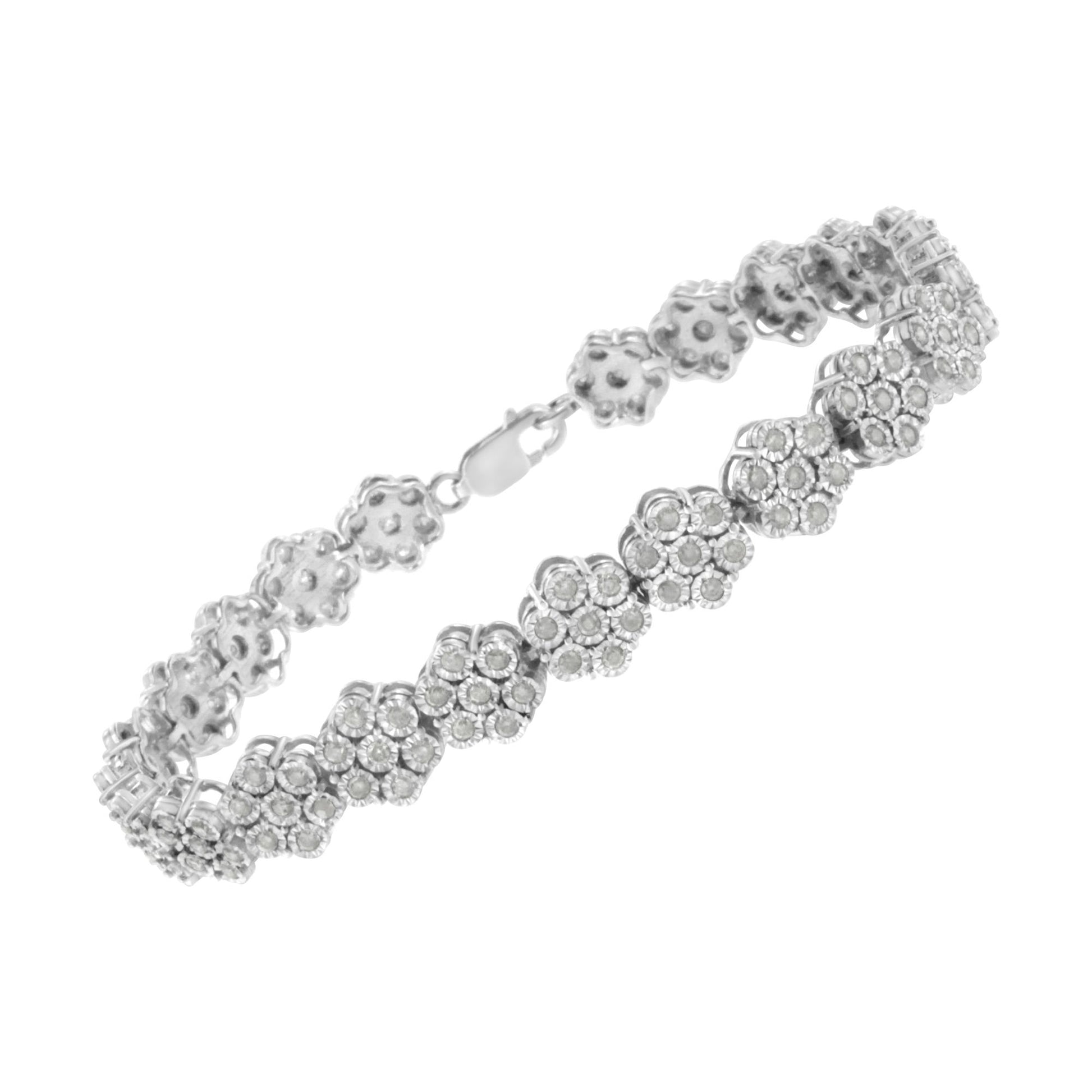 White metal bracelet with floral cluster design featuring round white gemstones in a miracle setting, shown in a side angle view.