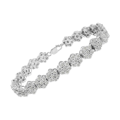 White metal bracelet with floral cluster design featuring round white gemstones in a miracle setting, shown in a side angle view.