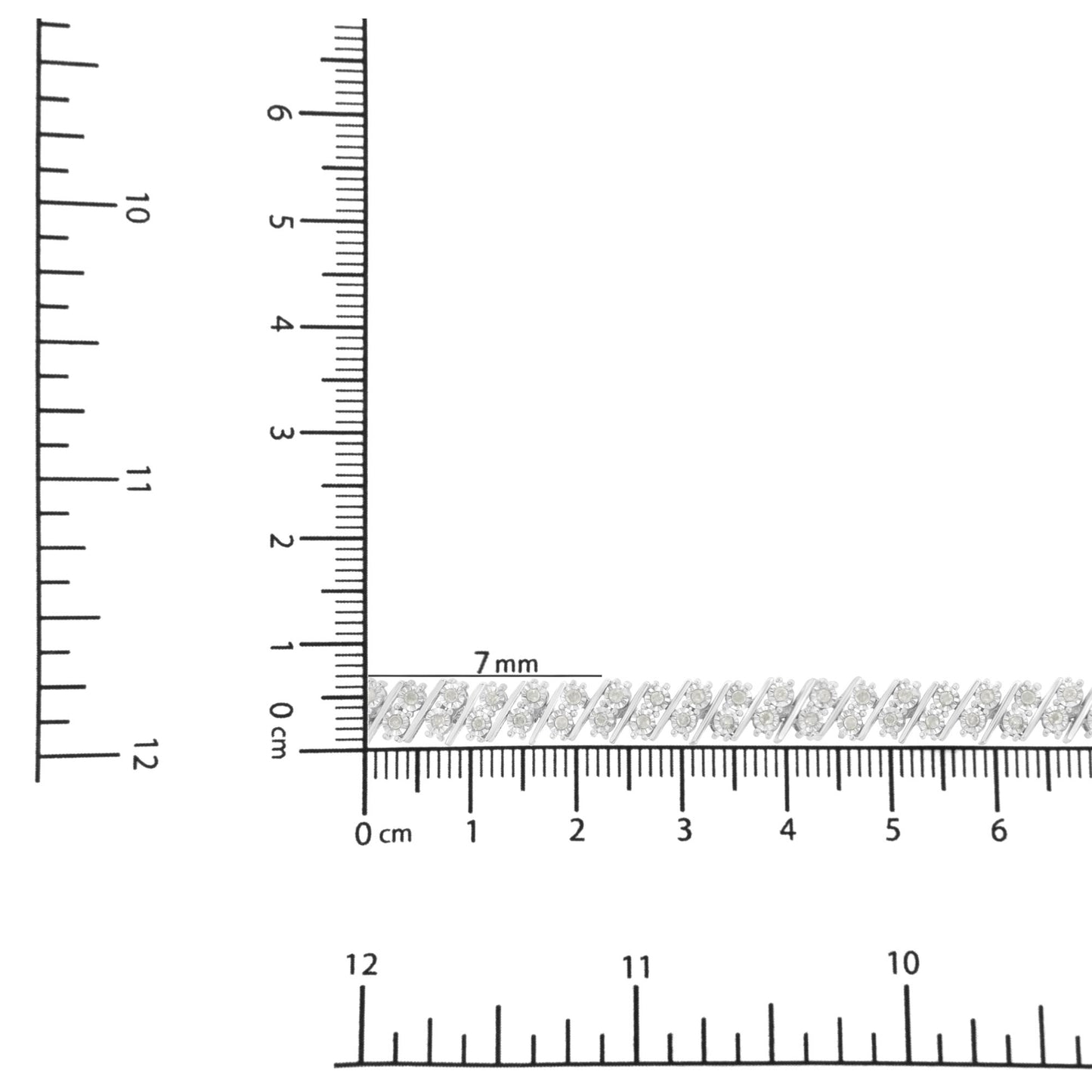 White metal bracelet with round white gemstones in miracle setting, placed on a ruler for size reference, top-down angle.