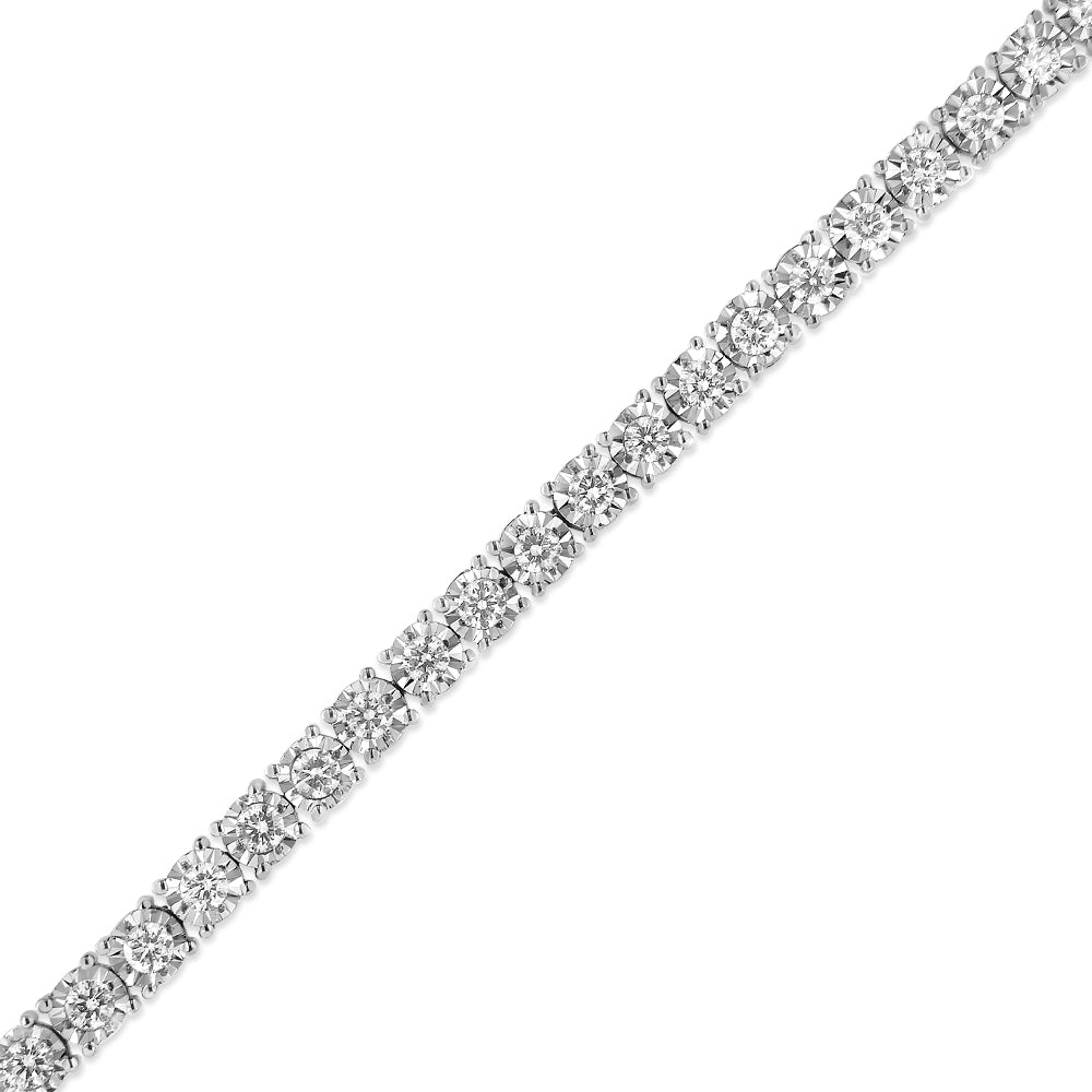 White metal bracelet with round white gemstones in miracle setting, shown at a diagonal angle on a white background.