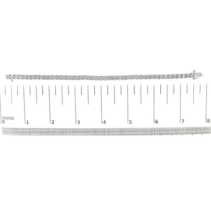 White metal bracelet with round white gemstones in miracle setting, displayed flat on a ruler for size reference, top-down angle.
