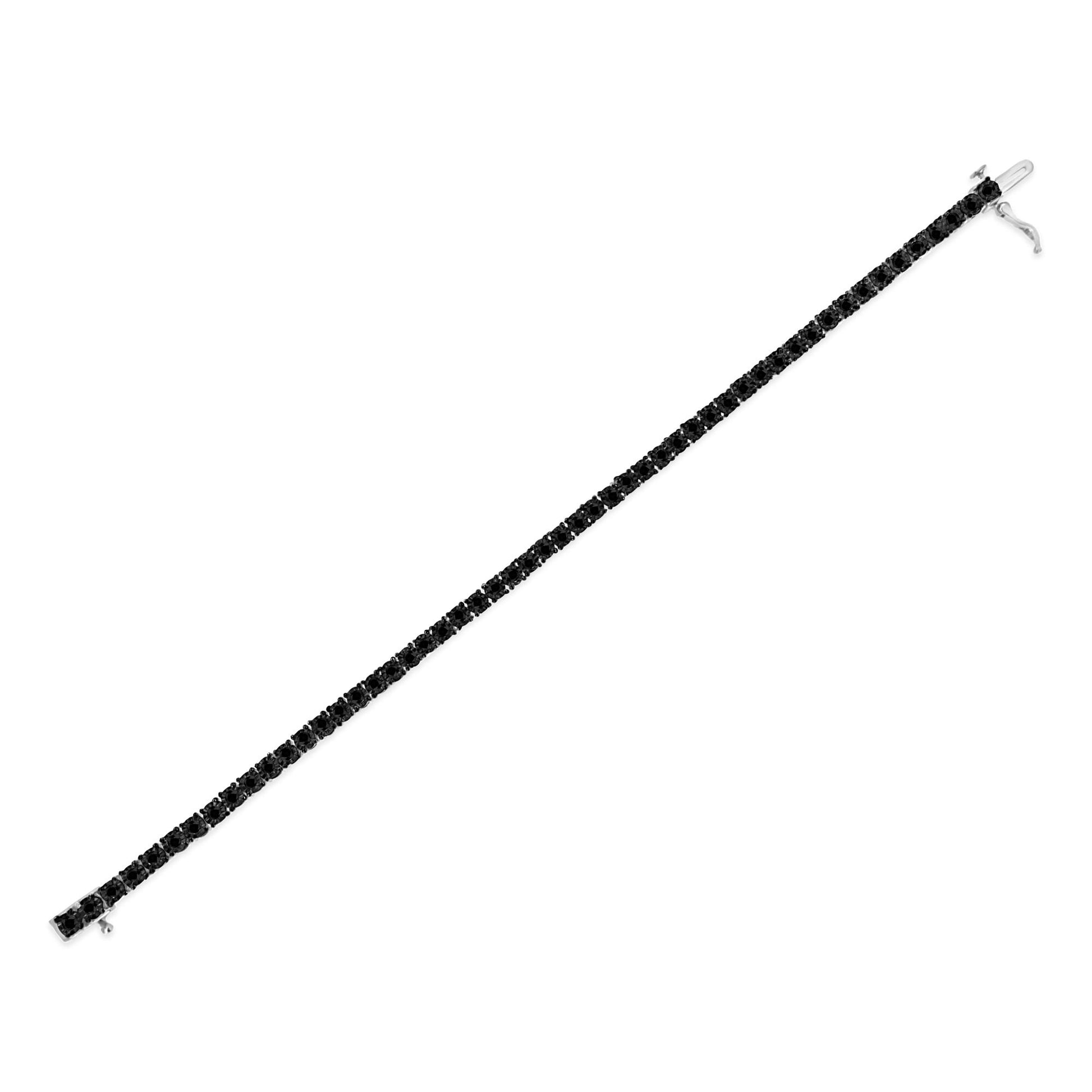 White bracelet with round black gemstones in a miracle setting, shown flat in a top-down angle.