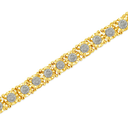 Close-up angle of a yellow bracelet with round brownish gemstones in a miracle setting along its length.
