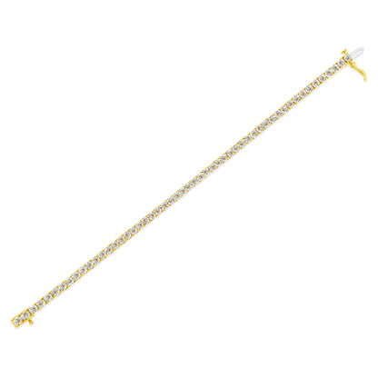 Close-up, angled top view of a yellow bracelet featuring round white gemstones in a single row with a visible clasp.