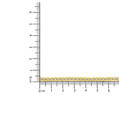 Yellow metal bracelet with round brownish gemstones in miracle setting, laid flat on ruler for size reference, top-down angle.