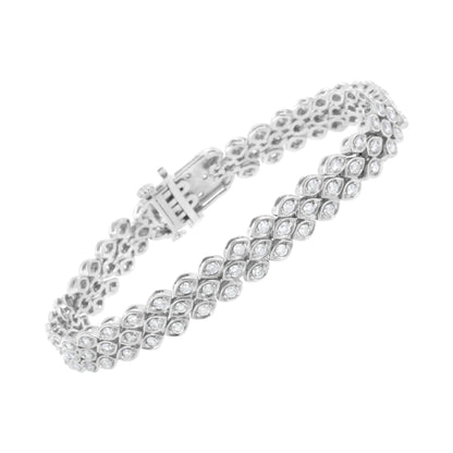 White metal bracelet set with round white gemstones in a pave setting, shown at a slight angle.