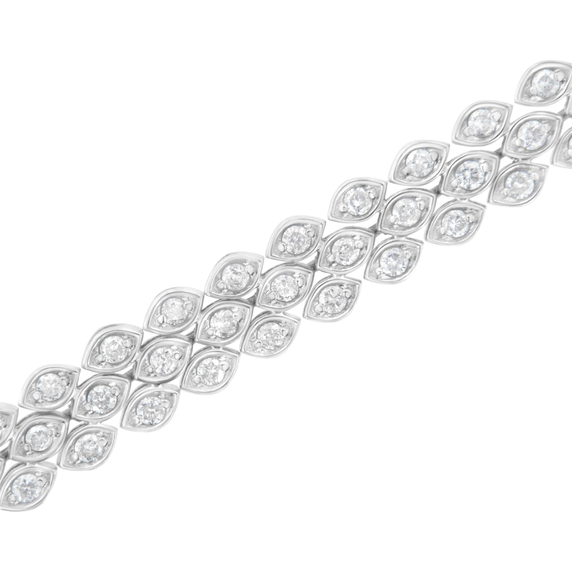 Diagonal close-up of a white metal bracelet featuring multiple marquise-shaped segments each set with a round white gemstone in a pave setting.