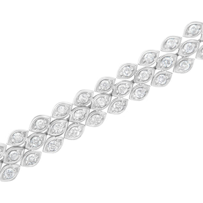 Diagonal close-up of a white metal bracelet featuring multiple marquise-shaped segments each set with a round white gemstone in a pave setting.
