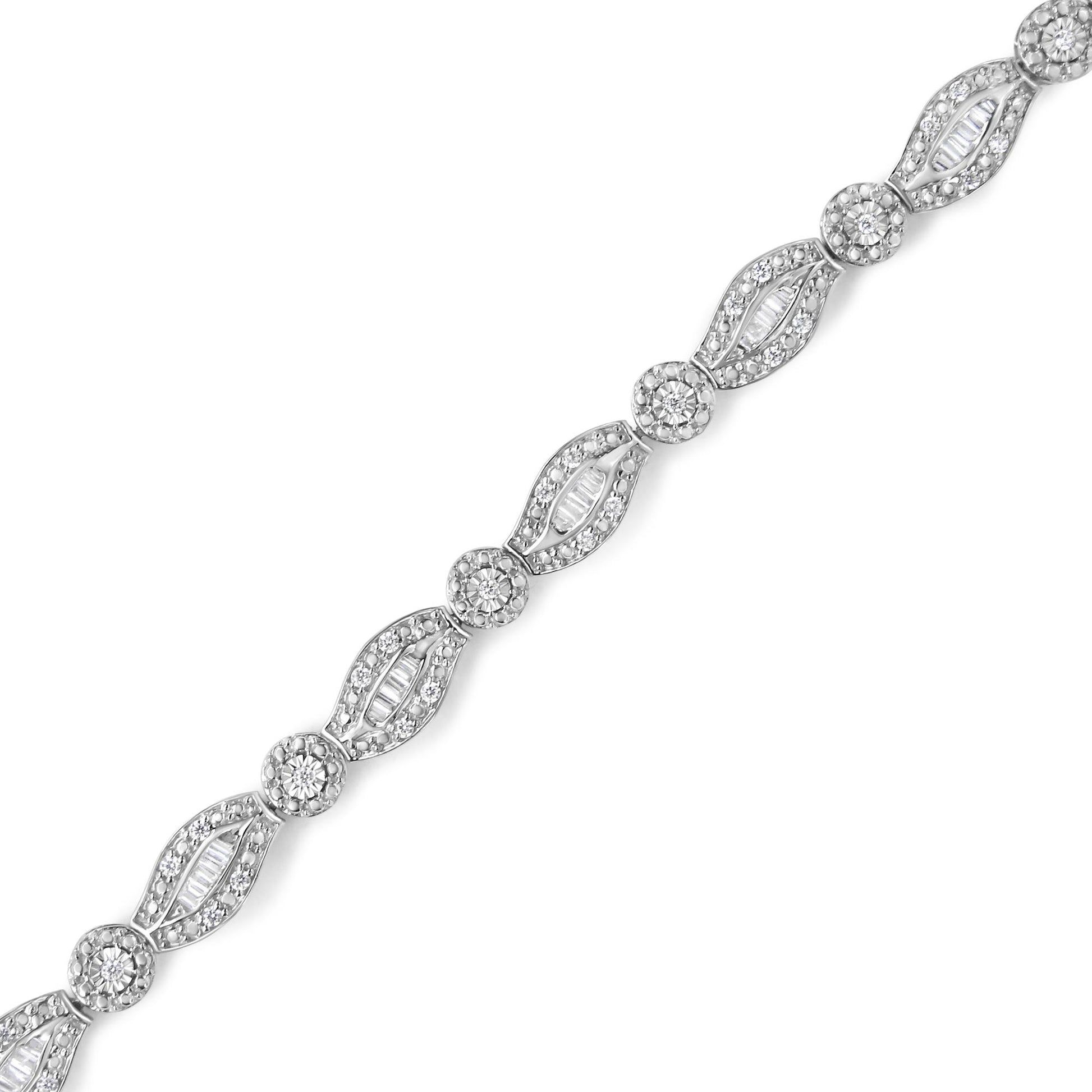Diagonal close-up of a white metal bracelet featuring alternating round white gemstones in prong settings and baguette white gemstones in channel settings.