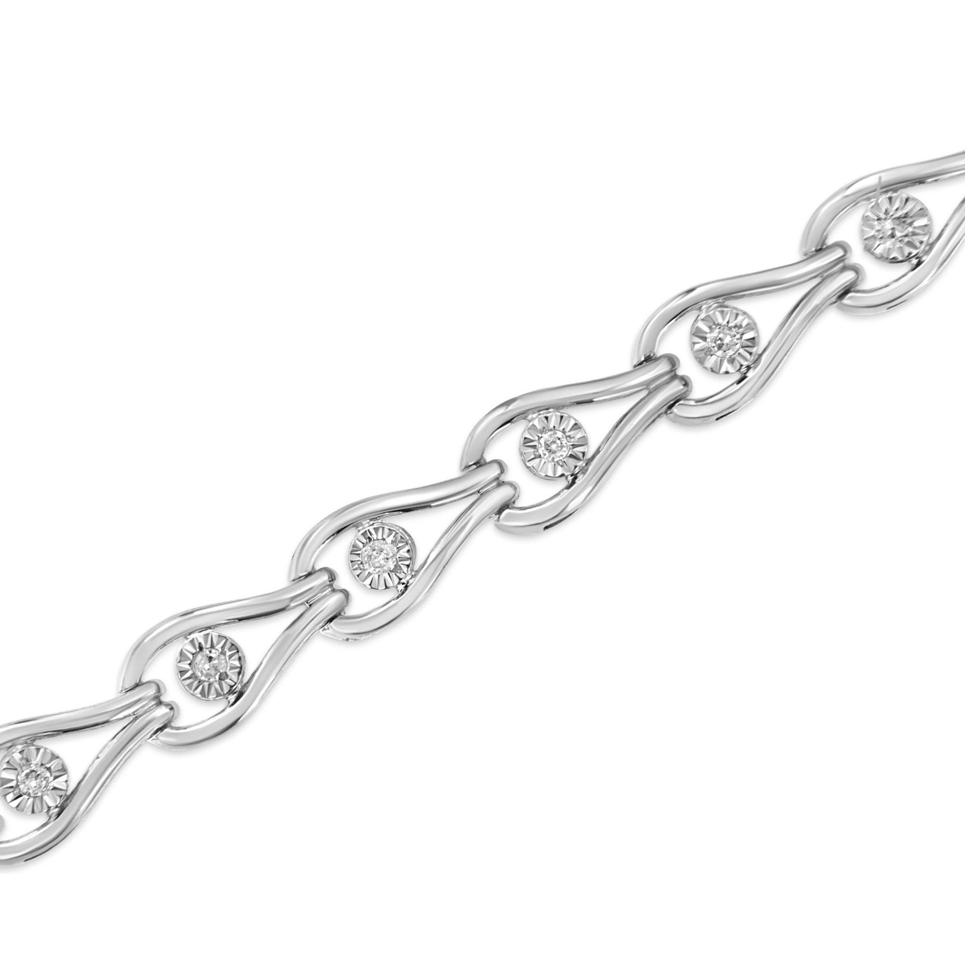 Close-up angle of a white metal bracelet featuring round white gemstones set in a miracle setting within a linked design.