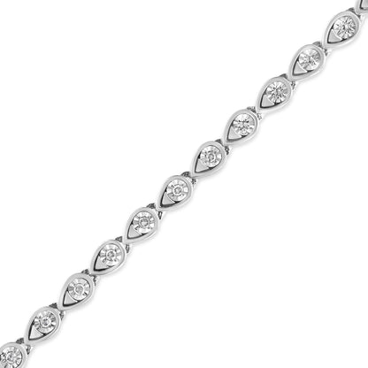 White metal bracelet with round white gemstones in teardrop-shaped settings, shown in a close-up angled view.