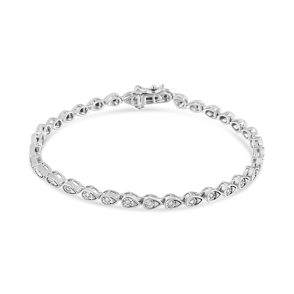 White metal bracelet with round white gemstones in a miracle setting, displayed flat on a white background, angled from above.