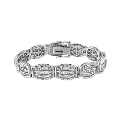 White metal bracelet with multiple sections set with round white gemstones in prong settings, shown from a front angle.