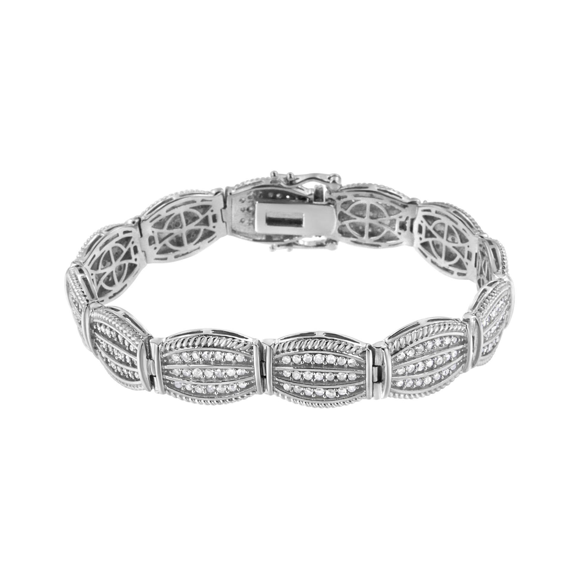White metal bracelet with multiple oval-shaped segments set with rows of small round white gemstones in prong settings, viewed from the top angle.